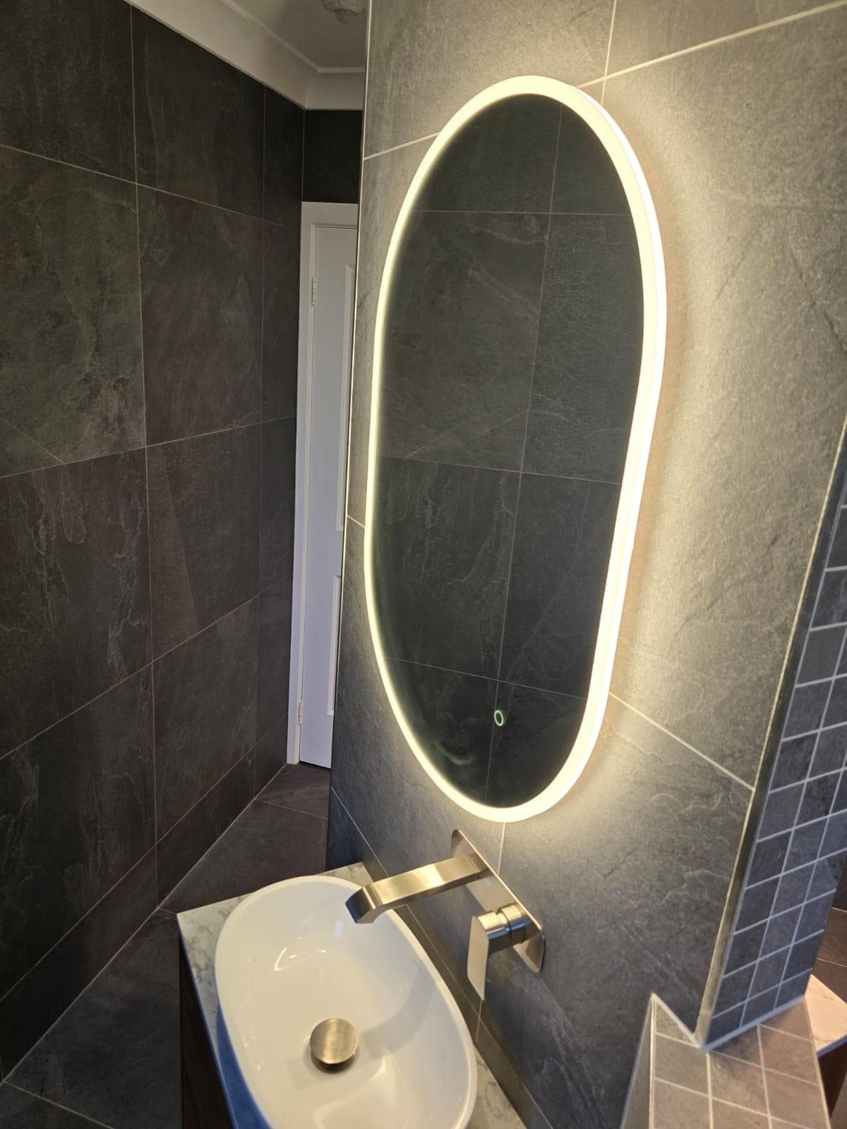 Modern bathroom renovation in Canberra with sleek design and elegant finishes