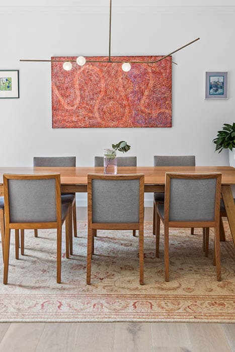 Modern dining area renovation in Canberra, Australia with stylish furniture and decor.