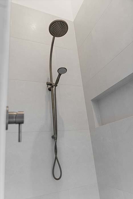 Modern shower design in Canberra, Australia with sleek fixtures and elegant finishes.