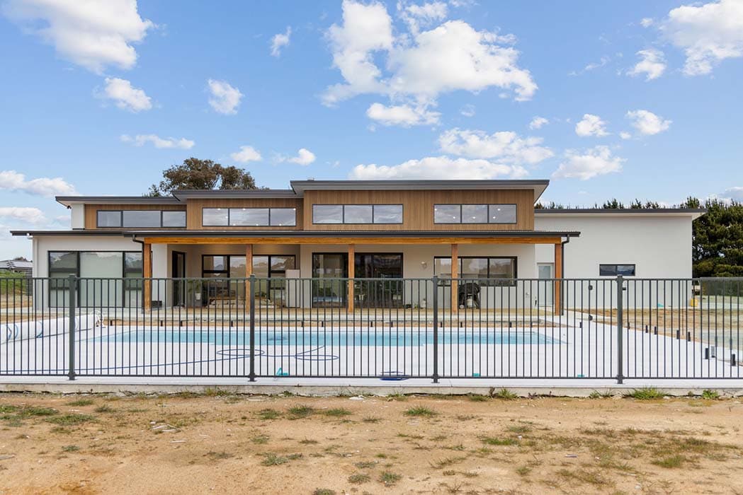 Modern new build with pool in Canberra, Australia, showcasing contemporary design and outdoor living.