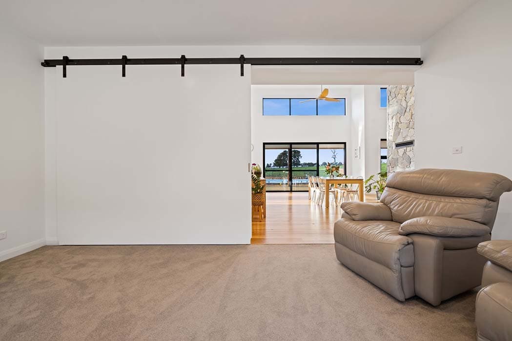 Modern living space with barn door in Canberra, Australia
