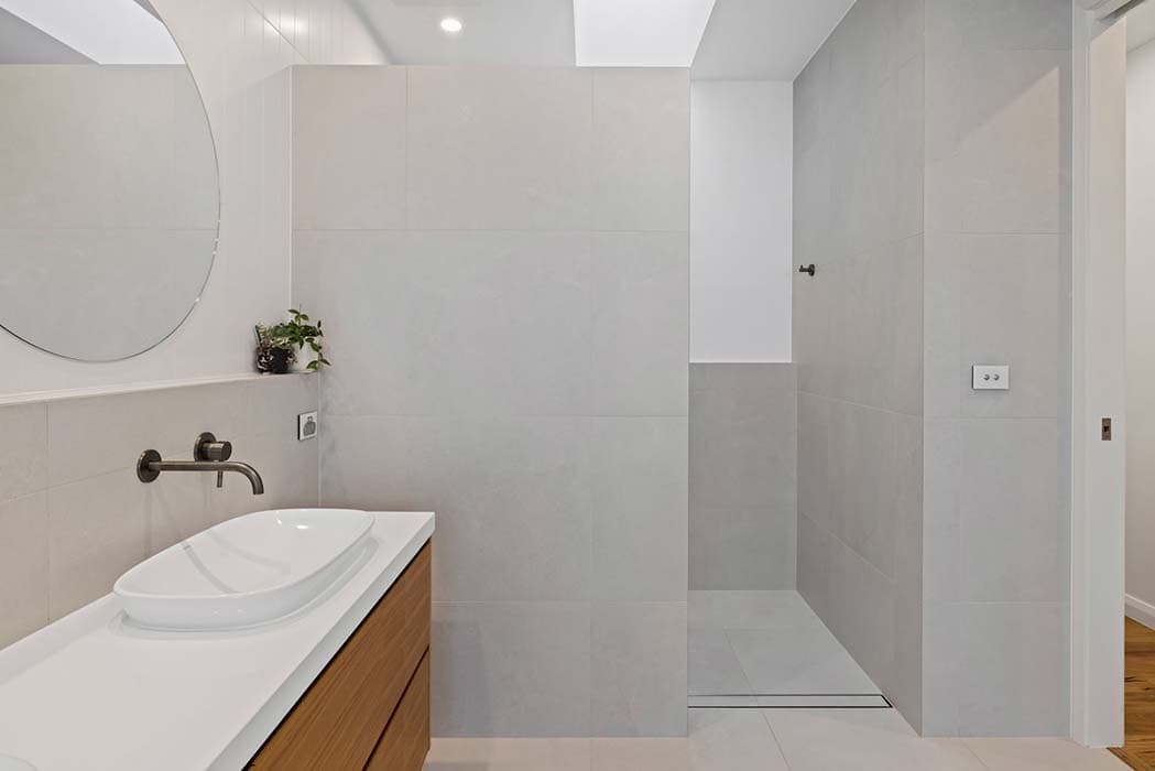 Modern bathroom renovation in Canberra, Australia with sleek design and elegant finishes.