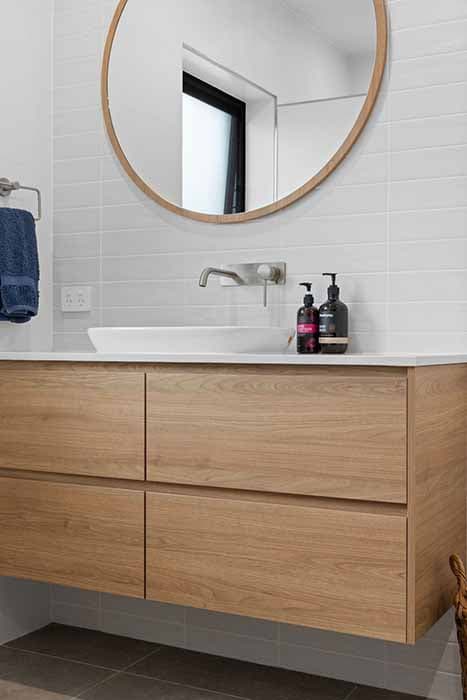 Modern bathroom renovation in Canberra with timber vanity and stylish fixtures