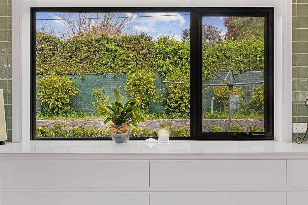 Modern kitchen window with garden view in Canberra, Australia