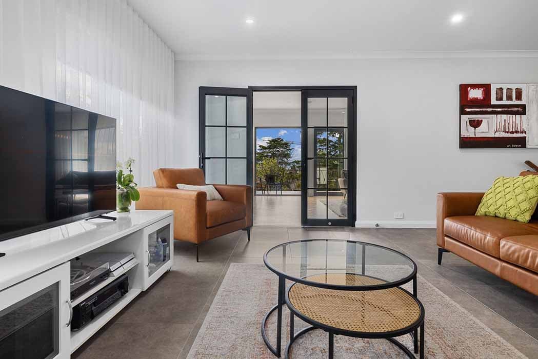 Modern living room renovation in Canberra, Australia with stylish decor and natural light.