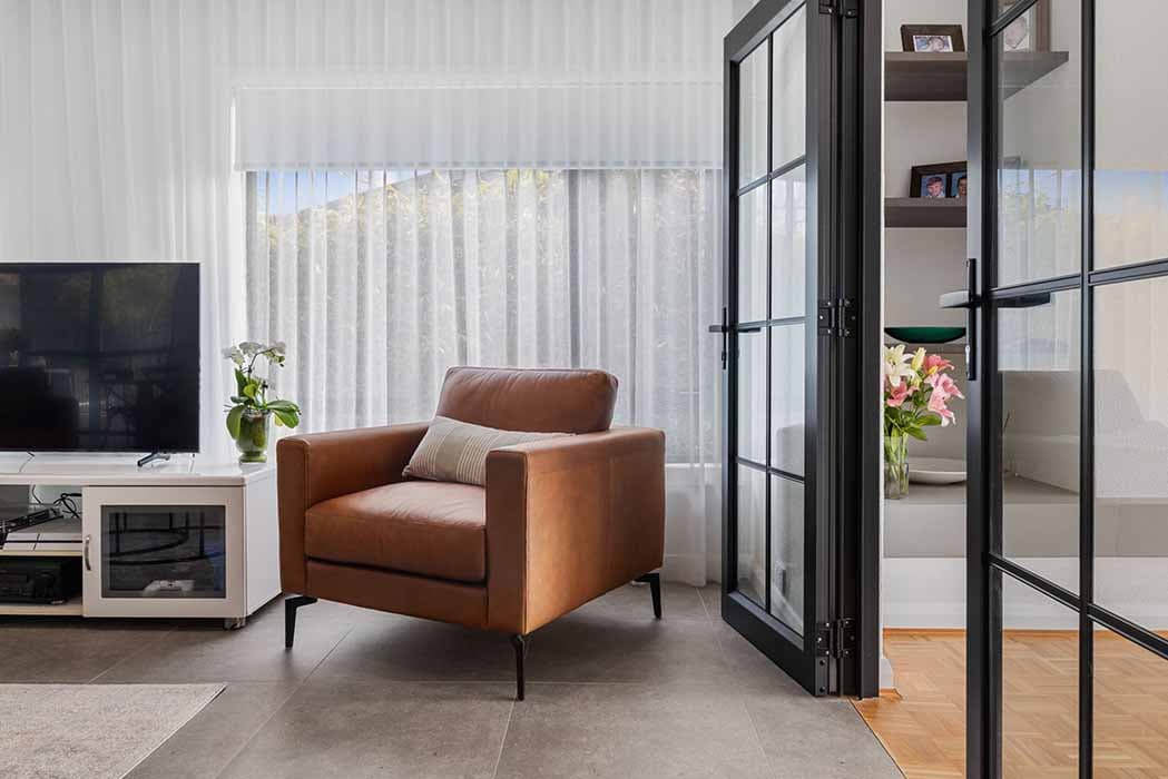 Modern living room renovation in Canberra, Australia with stylish furniture and natural light.