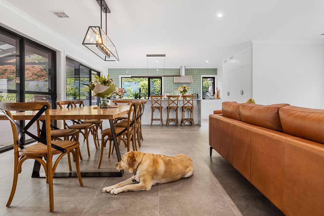 Modern open-plan renovation in Canberra, Australia featuring stylish kitchen and dining area.