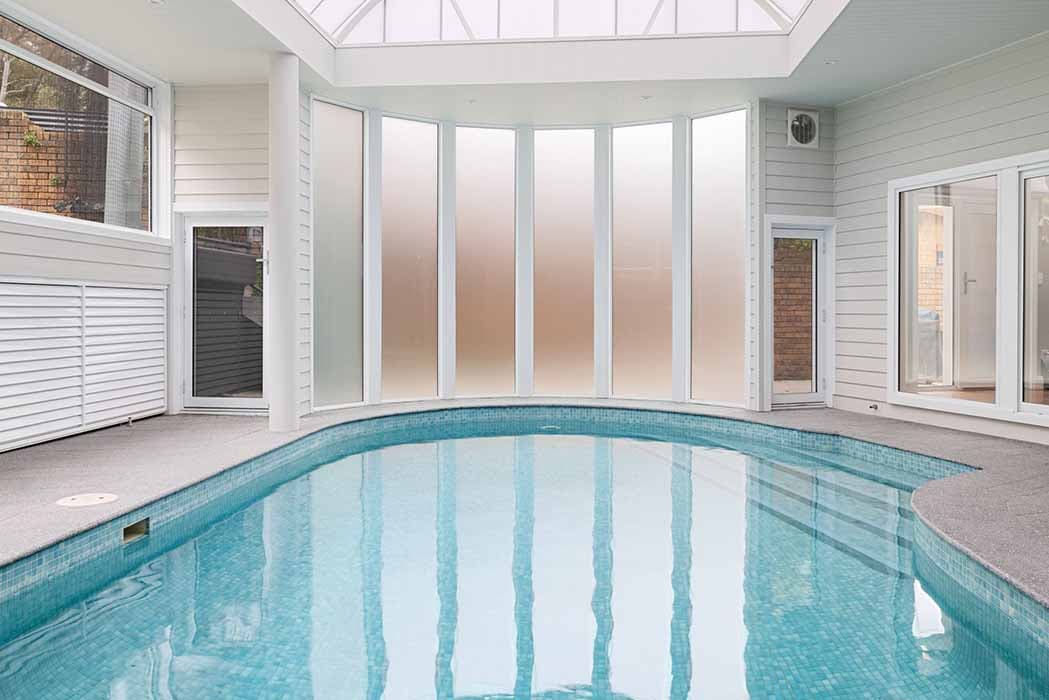 Indoor pool renovation in Canberra, Australia with modern design and natural light.