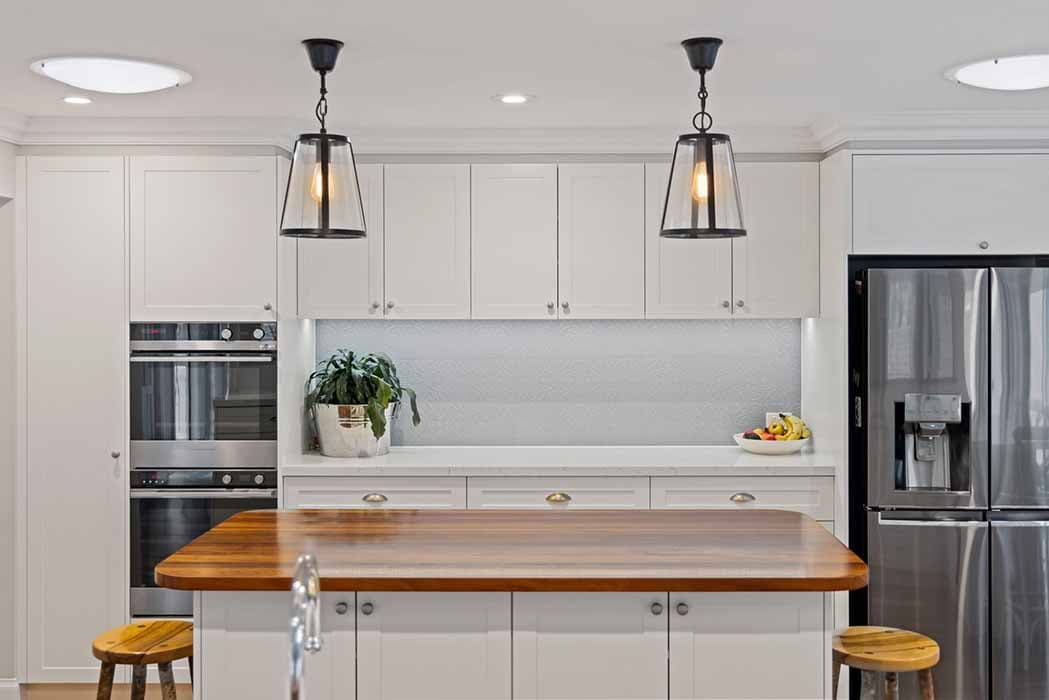 Modern kitchen renovation in Canberra, Australia with timber island and elegant finishes.