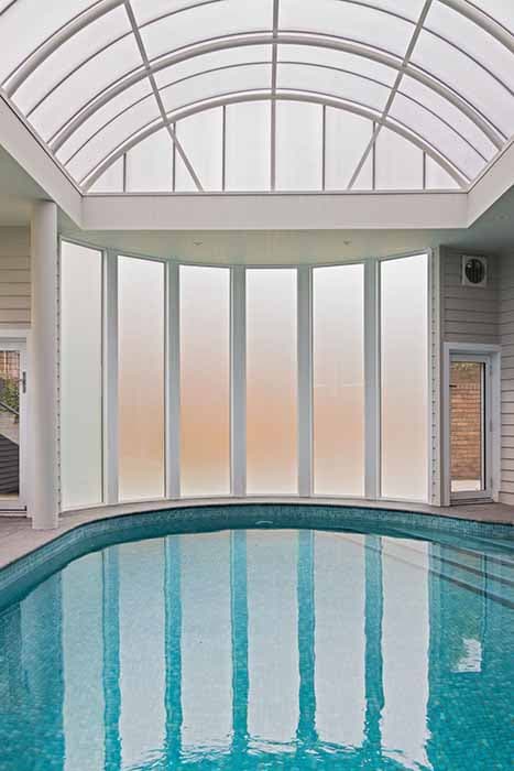 Indoor pool renovation in Canberra, Australia with modern glass features