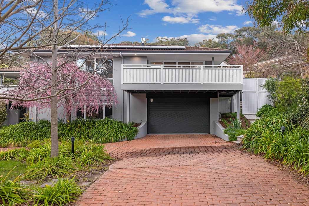 Modern home renovation in Canberra with stylish facade and landscaped garden.