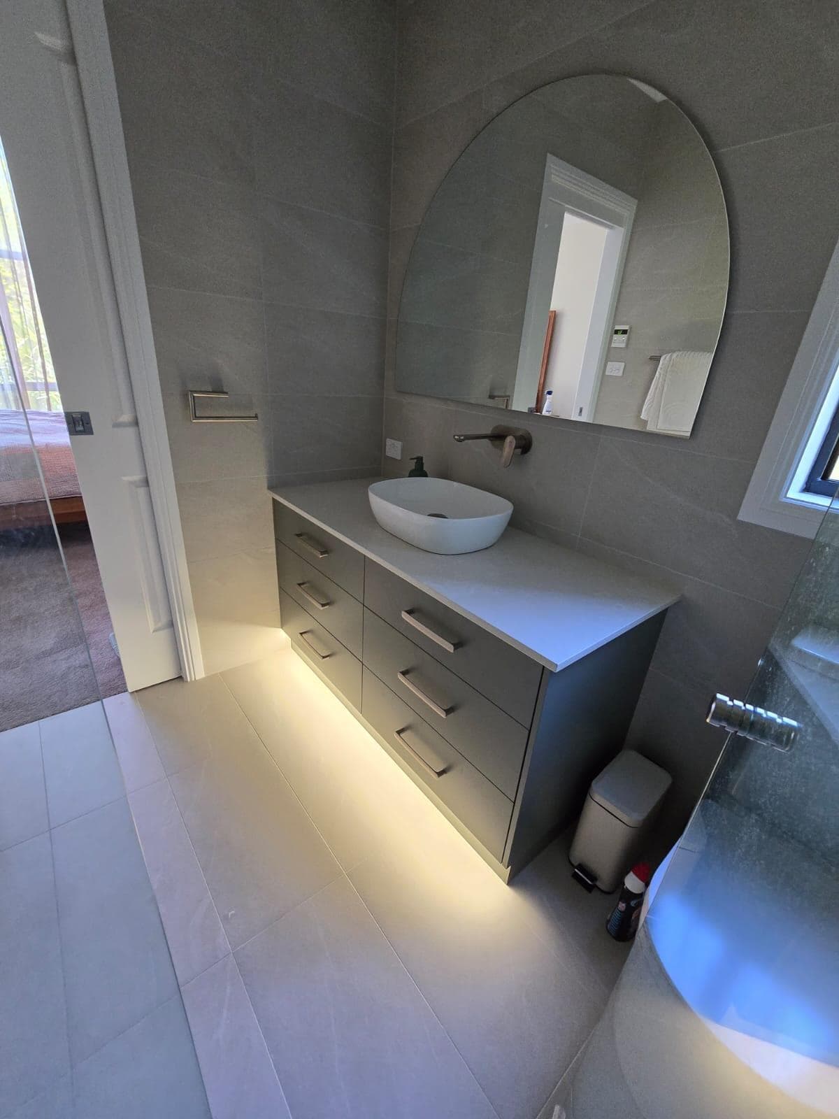 Modern bathroom renovation in Canberra, Australia with sleek finishes and elegant design.