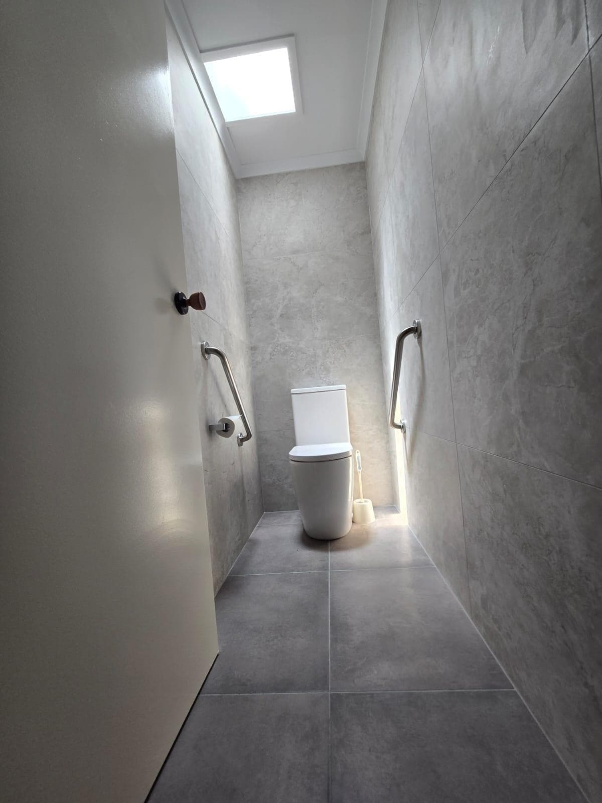 Modern bathroom renovation in Canberra with sleek design and natural light