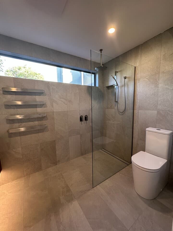 Modern bathroom renovation in Canberra with walk-in shower and sleek finishes
