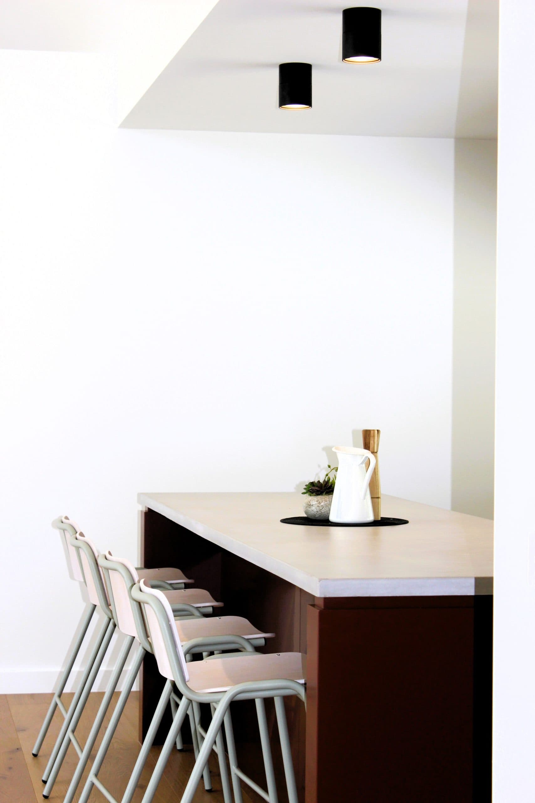 Modern kitchen renovation in Canberra, Australia with stylish island and contemporary lighting.