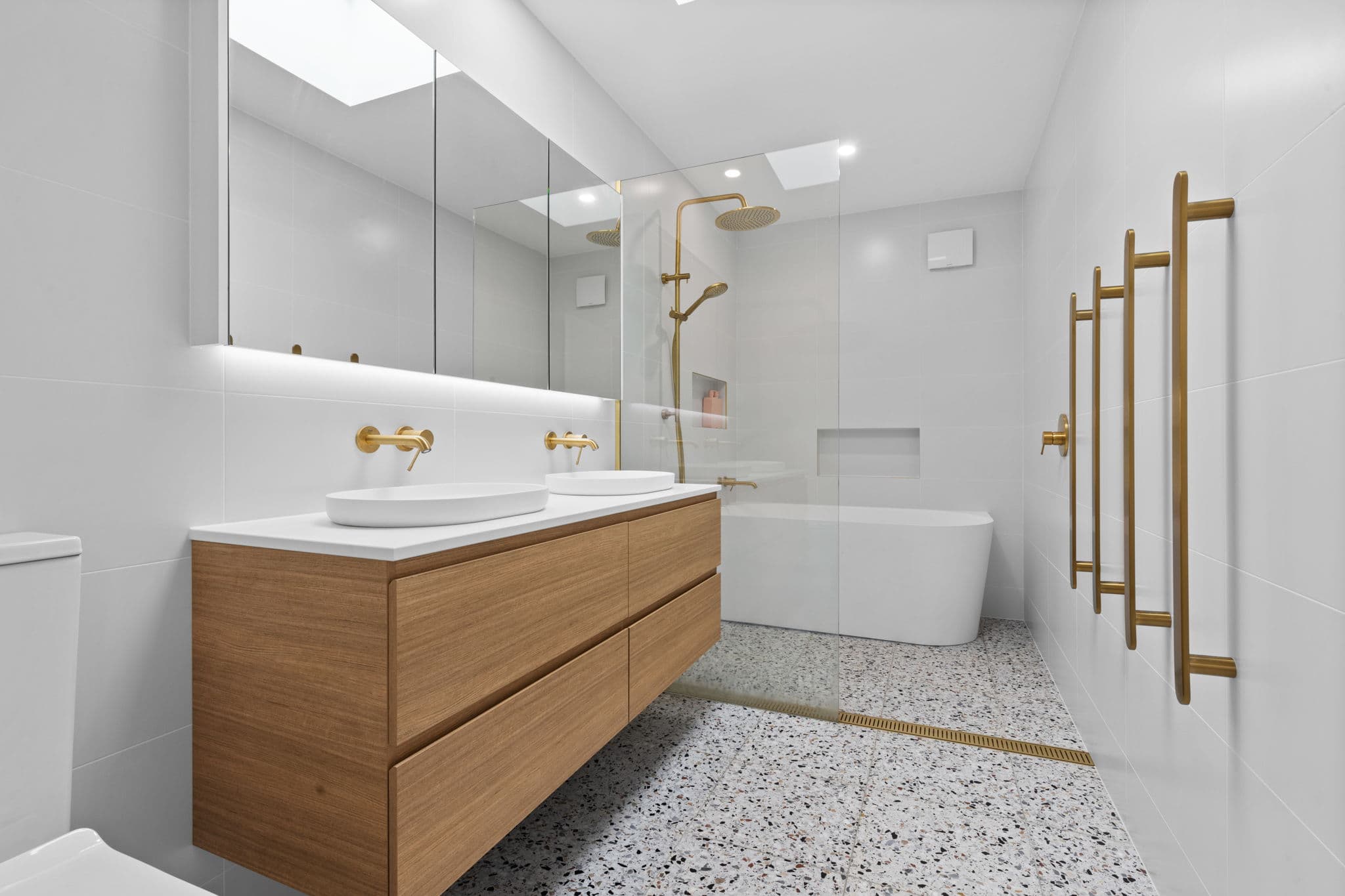 Modern accessible bathroom renovation in Canberra with walk-in shower and safety features