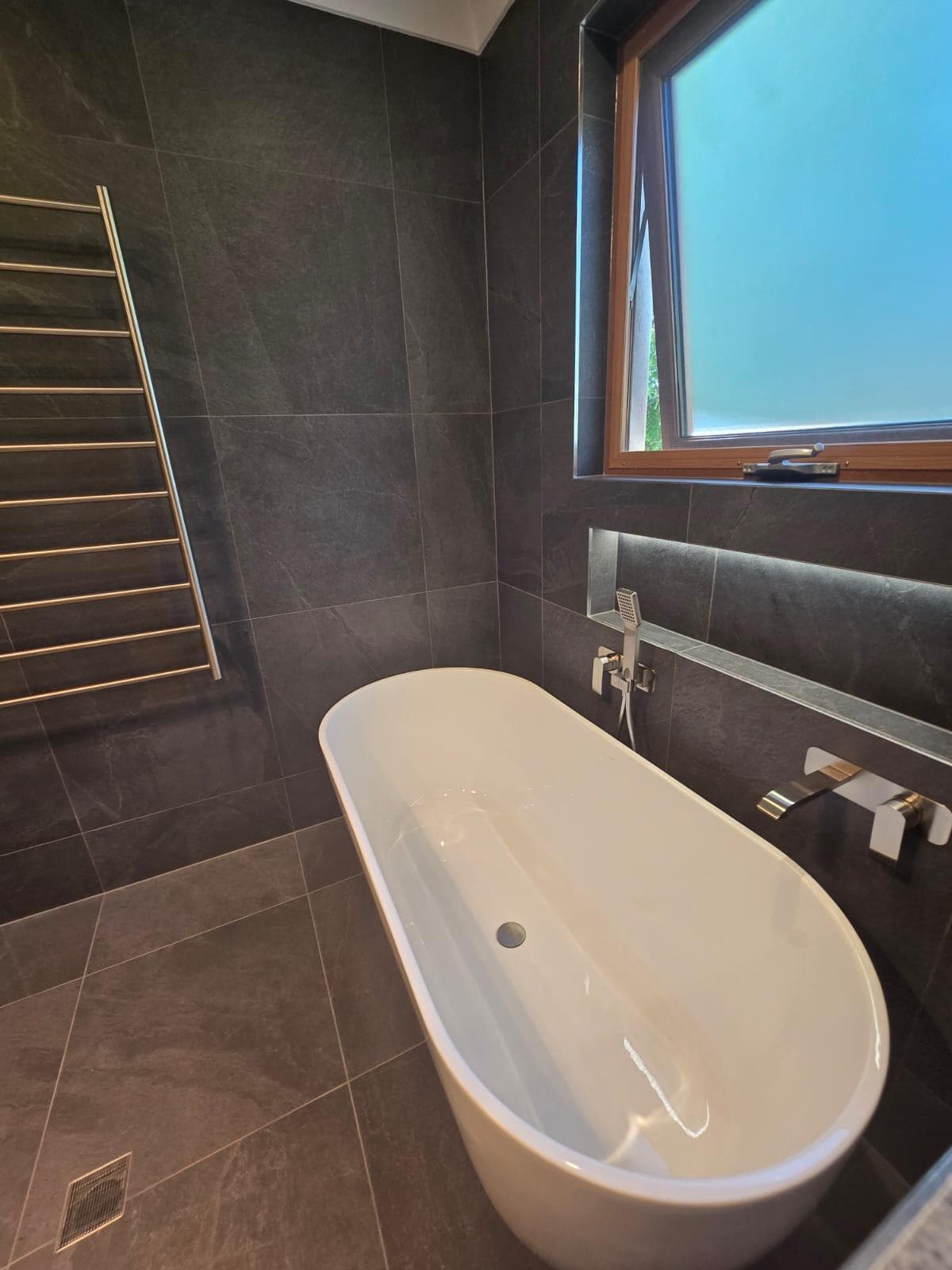 Before and after accessible bathroom renovation showing improved safety features