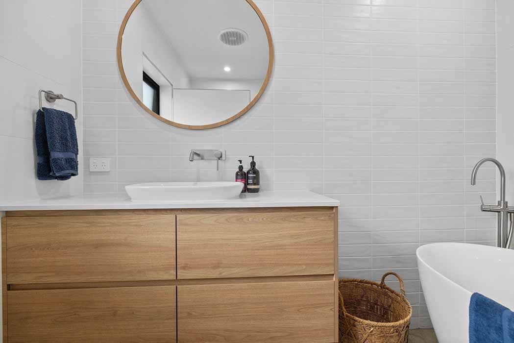Modern bathroom renovation in Canberra, Australia with stylish finishes and fixtures.